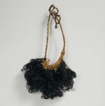 Arm or leg ornament ouoho Arm or leg ornament made of the locks of curled human hair wrapped with fibres and set into a plaited band.