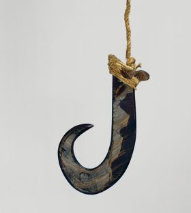Fishhook matau Large fishhook made of dark purple pinna marina shell with strings made of various plant fibres attached.
