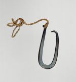 Fishhook matau Fishhook made of a large dark purple pinna shell where strings made of various plant fibres are attached.