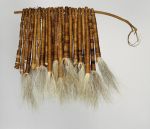 Tassels of hair Tufts of dog hair bundled together into twenty-two tassels and tightly wrapped both length-wise and crosswise with fine coconut fibre threads and threaded onto a stick.