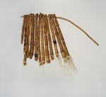 150.jpg Tufts of dog hair bundled together into thirteen tassels and tightly wrapped both length-wise and crosswise with fine coconut fibre threads and threaded onto a stick.