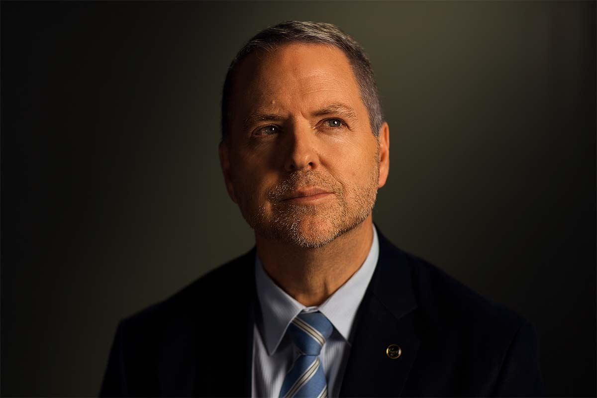 Studio portrait photograph of Jon Rouse.