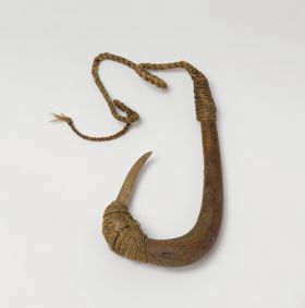 Fishhook matau Fishhook with wooden shank, with a bone point lightly curved and lashing at the bone point and upper shank made of plant fibres extending to a twisted cord.