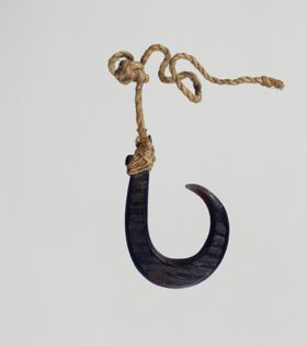 Fishhook matau Fishhook made of large dark purple pinna marina shell, where strings made of various plant fibres are attached.