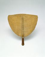 93.jpg Fan made of wicker, worked onto a medium-brown polished wooden handle.