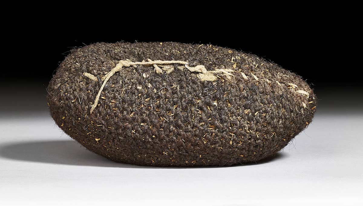 A bag woven from human hair, for the purpose of carrying pituri.