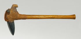 Adze to’i Large T-shaft stone axe with a handle made from medium brown hardwood and a blade made of fine-grained black basalt both tied together with coconut fibre.