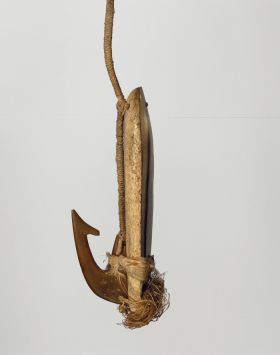 Fishhook ipa or aipa Fishhook with whalebone shank backed with mother-of-pearl and tied together, with a barbed tortoiseshell hook and attached to the end.