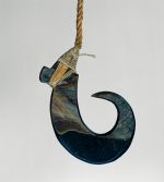 Fishhook matau Fishhook made of a large dark purple pinna shell where strings made of various plant fibres are attached.