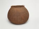 Basket Barrel-shaped basket made of woven coconut leaf ribs, sticks and plant fibre.