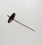 120.jpg Spinning top that is a kind of bean with a thick dark brown shell, in which a hole is made and one end of a small stick put through it.