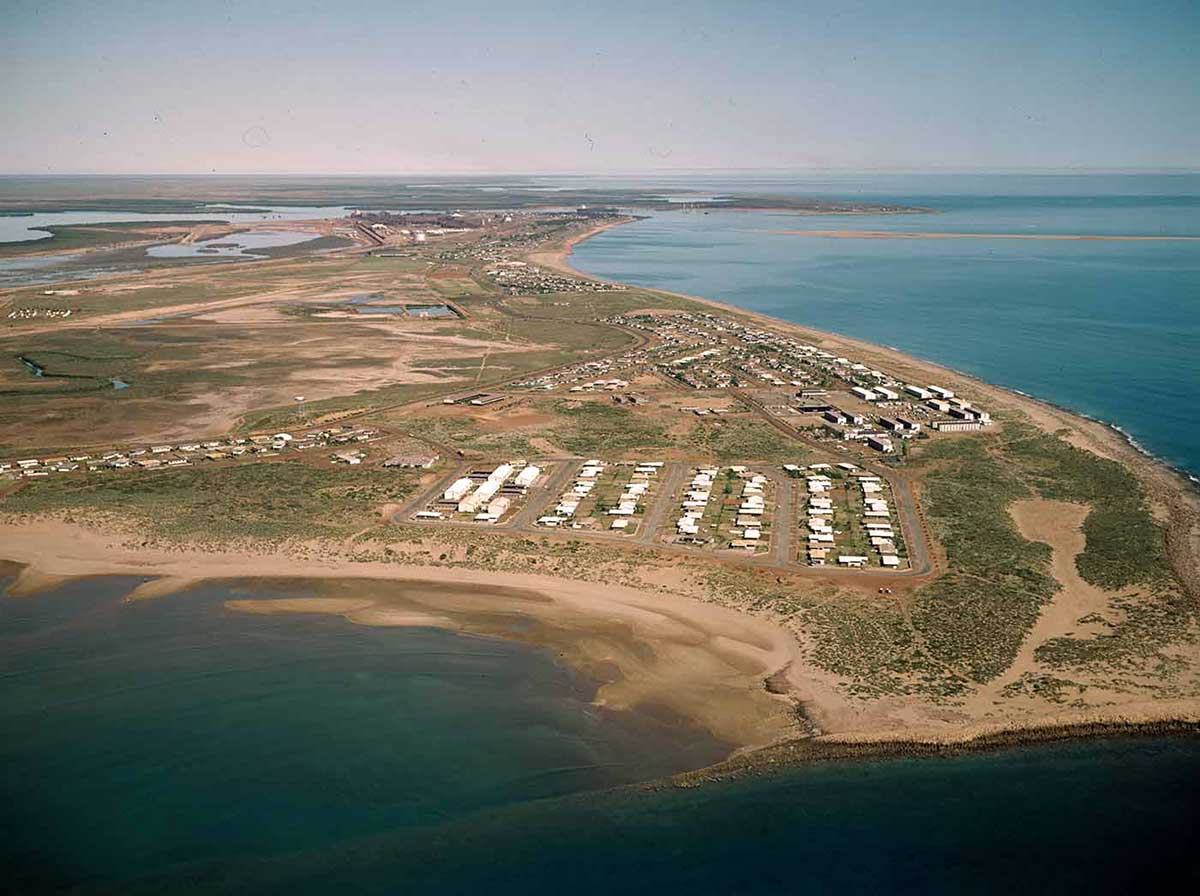 Aerial view of buildings situated on a headland.