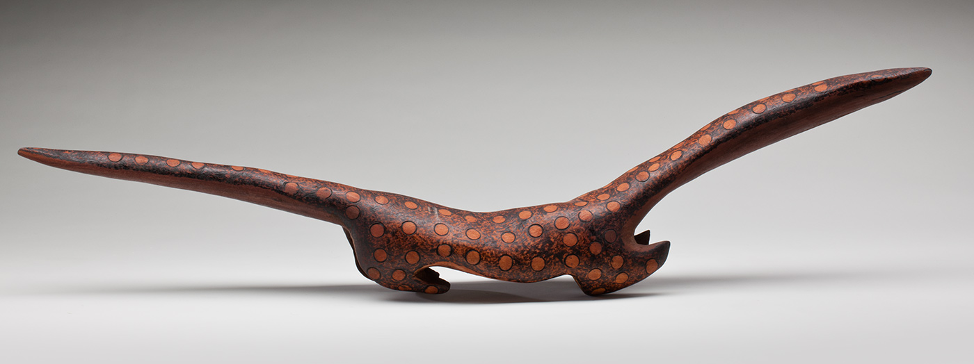 Ngintaka sculpture carved from red gum timber.