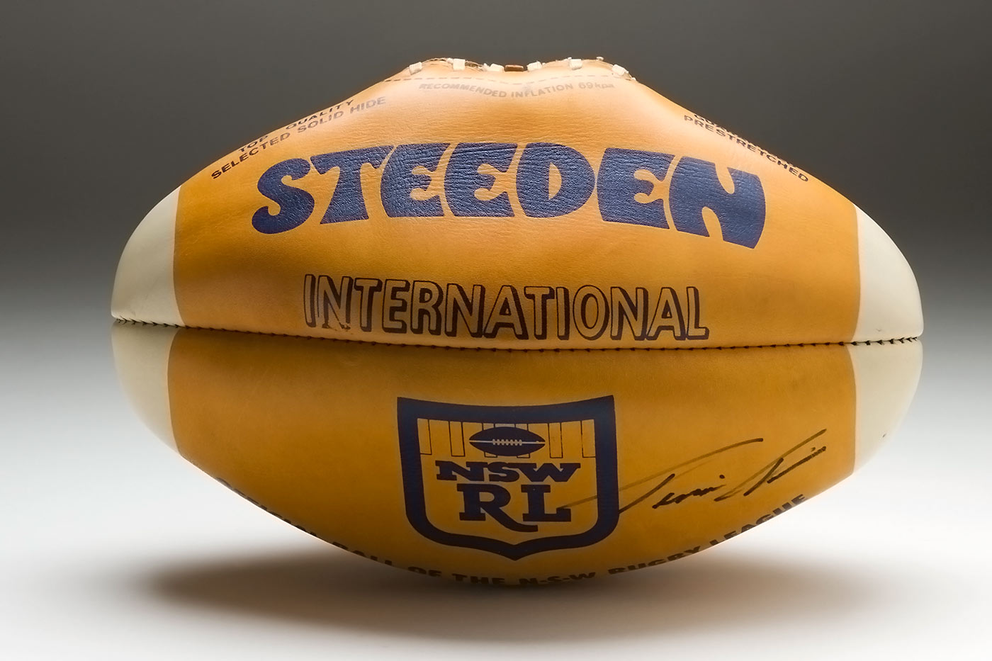 Steeden brand rugby ball with a NSWRL logo and a handwritten signature bottom right.