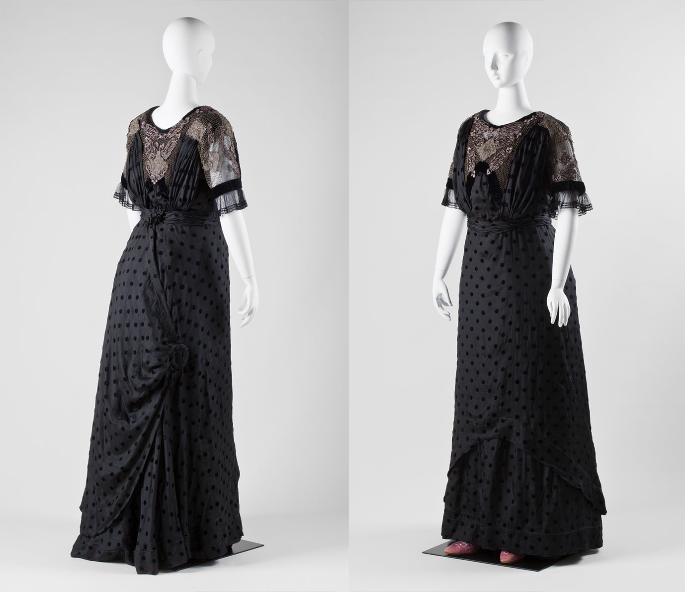 A rear and front view of a black evening gown on a white mannequin.