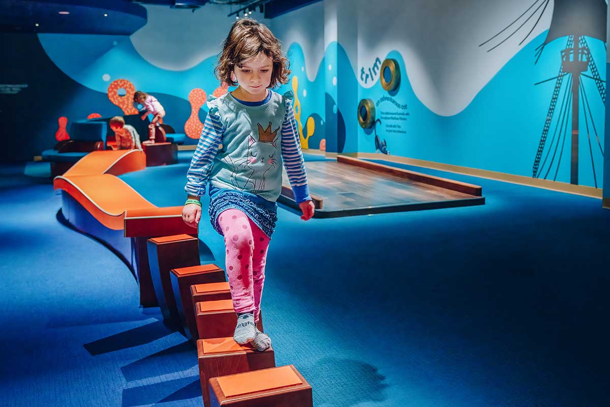 A child plays in the Discovery Centre play space at the National Museum of Australia.