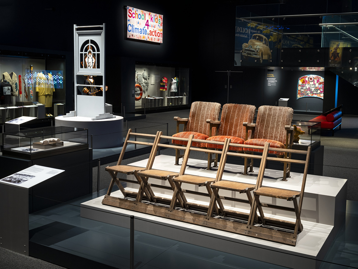 Photograph of the Landmarks gallery. The photo shows some of the galleries objects like the arch window from Playschool and the Ray-Mond Theatre seats. 