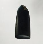 Adze blade toki Adze blade made of hard black basalt stone with a rounded off neck, also rounded off lengthwise in cross-section.