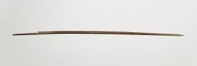 Bow kaufana Bow made of brown wood and curved, becoming slightly thinner towards both ends (the string is missing)