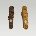 121.jpg Two bands made of plaited flax and wound up.
