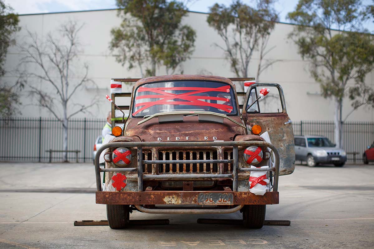 Front view of a Bedford truck with red tape across windscreen and lights.