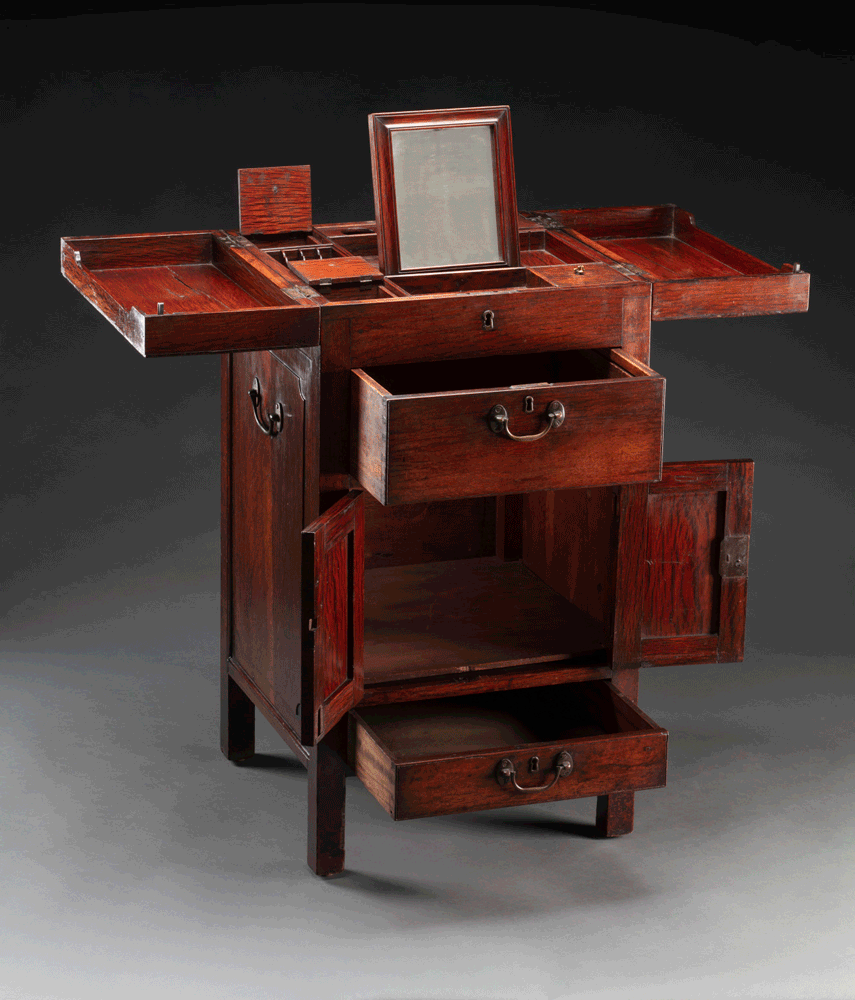 Animation of a wooden table unfolding its multiple compartments.