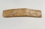 Adze blade ko’i Long adze blade, 14.5cm long, and made of a yellowish limestone. The upper and lower surfaces of the sharp edge are rectangular.