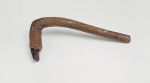 Adzes toki Stone adzes, with a round handle and knee made of a light brown lightweight wood with a four edged blade made of basalt, and attached to shaft with plaited coconut fibres.