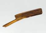 Bark beater ees’ee Bark beater made of a piece of whalebone, the head is trapeze-shaped and the end of the flat grip is wide and notched like a fishtail.