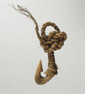 Fishhook matau Fishhook made of bone with serrated outer edge and twisted cord.