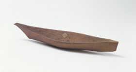 Model of a boat Model of a canoe made of wood with a beak like bow and steeply raised stem, replicating the Nootka dugout canoes that were thirteen metres long.