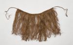 Skirt Skirt or apron made from fine shred of plantain leaf, dyed and knotted to a string that fastens around the waist.