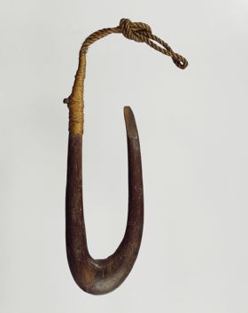 203.jpg Fishhook made of a finely polished piece of hardwood. The point of the hook is flat on the side and the upper end of the shank is supported and secured with plaited coconut fibres.