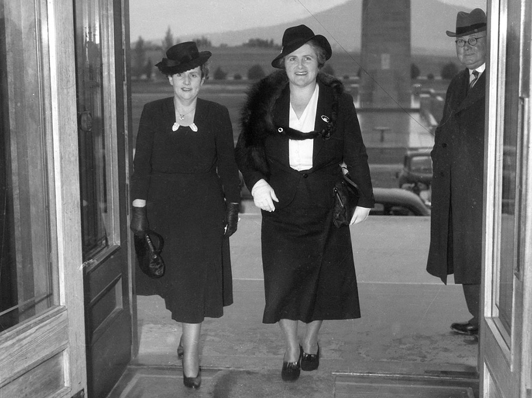 Two well-dressed women entering Parliament House in Canberra.
