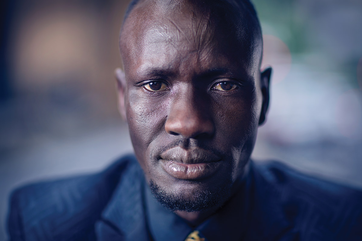 Studio portrait photograph of Deng Adut.