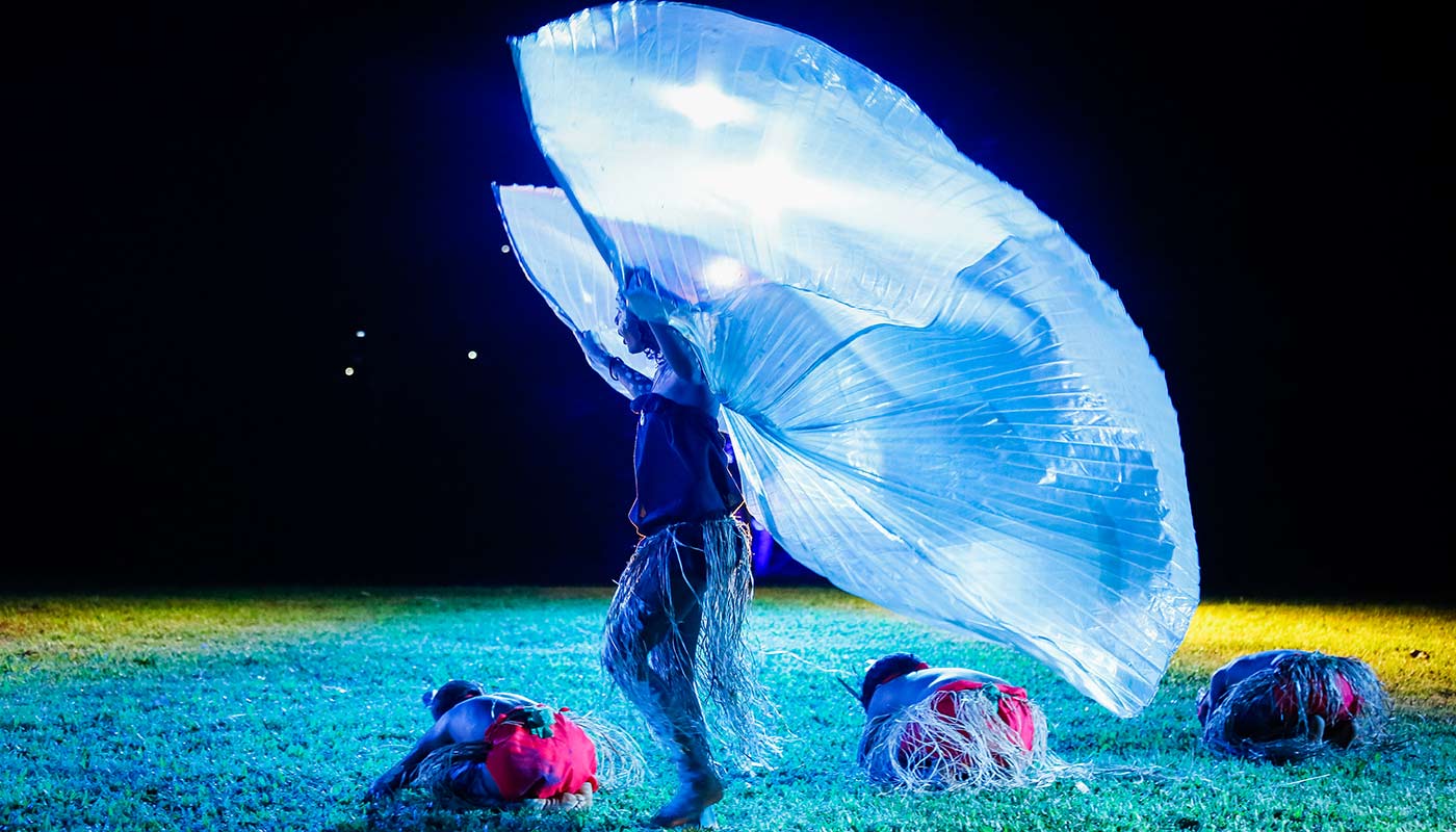 A small dance group performing at night at a Cooktown Discovery Festival.