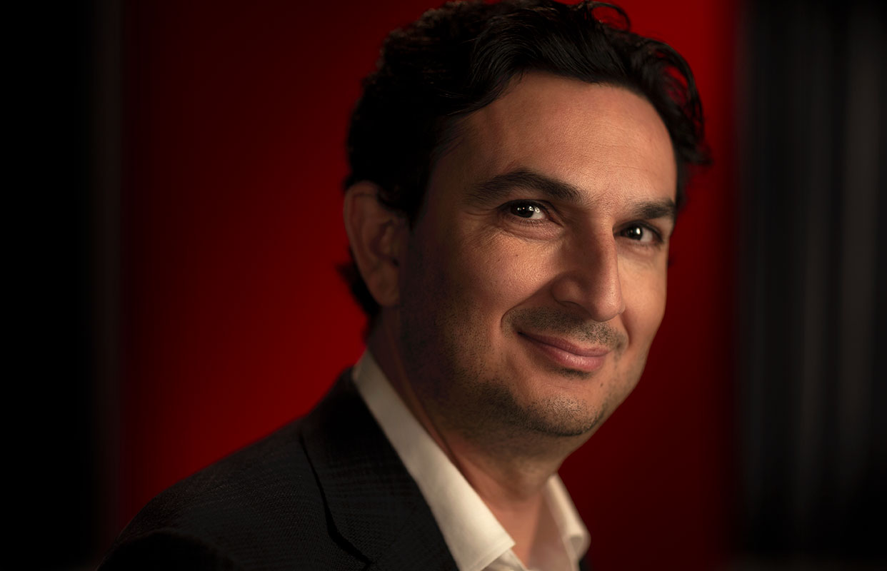 Studio portrait photograph of Munjed Al Muderis.