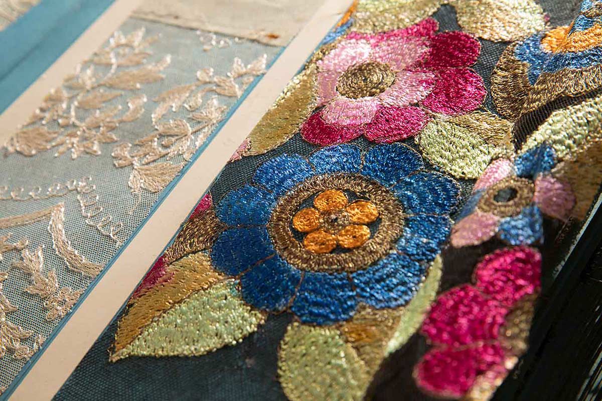 Colour photo of detail of lace samples.