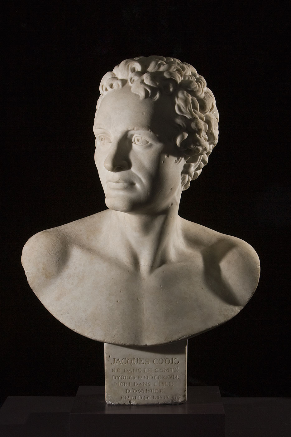 Marble bust of Captain James Cook with an inscription in French on the base.
