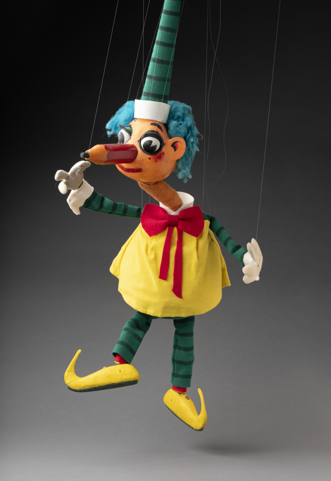 Image of a puppet with a pencil for a nose