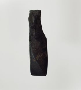 Adze blade Adze blade made of fine-grained black basalt and triangular in cross-section. Blade and cutting edge, as well as the sides, are smoothly polished.