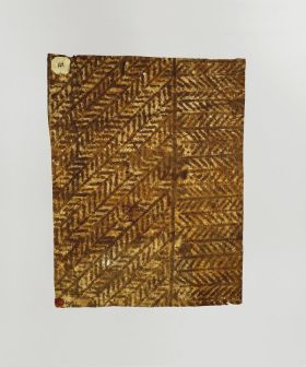 Barkcloth ngatu Barkcloth featuring brown herring-bone pattern in which each stripe is separated from the other by a line.