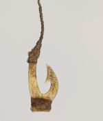 Fishhook makau Fishhook made of two pieces of bone bound together with a string made from plant materials. The barb located on inner side of hook with a brown fishing line attached.