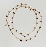 Neck ornament Necklace made from bird bones and small snail shells.