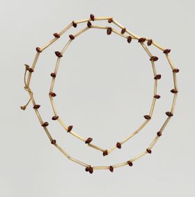 Neck ornament Necklace made from bird bones and small snail shells.