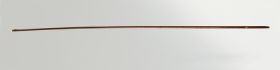 317.jpg Small narrow wand made of wood coated with the skin of a dog’s tail wrapped with a string made of a plant material.