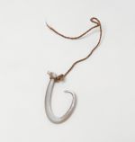 Fishhook matau Fishhook made of mother-of-pearl, where strings made of various plant fibres are attached.