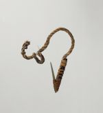 Fishhook matau Fishhook with shank made of black wood, fish bone point, with short, twisted cord, and lashing made of plant material.