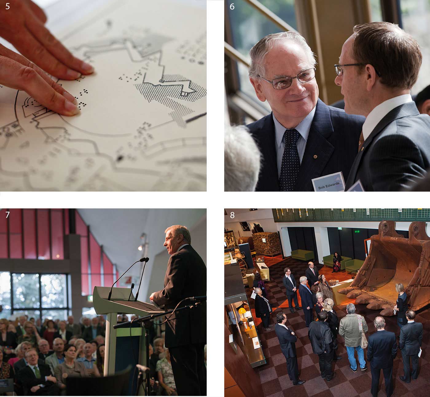 A compile of four roughly square-shaped photographs in a larger square. Top left, marked with a '5' shows a detail of a black and white map, with an unseen person resting two fingers from each hand on the surface. Top right, marked with a '6' shows Bob Edwards and Andrew Sayers in conversation. Bottom left, marked with a '7, shows a man speaking at a podium before a seated crowd of people at the 'Not Just Ned' exhibition launch. Bottom right, marked with an '8', is taken from above and shows 13 people standing before a large, rusted metal digger bucket in the Landmarks gallery.