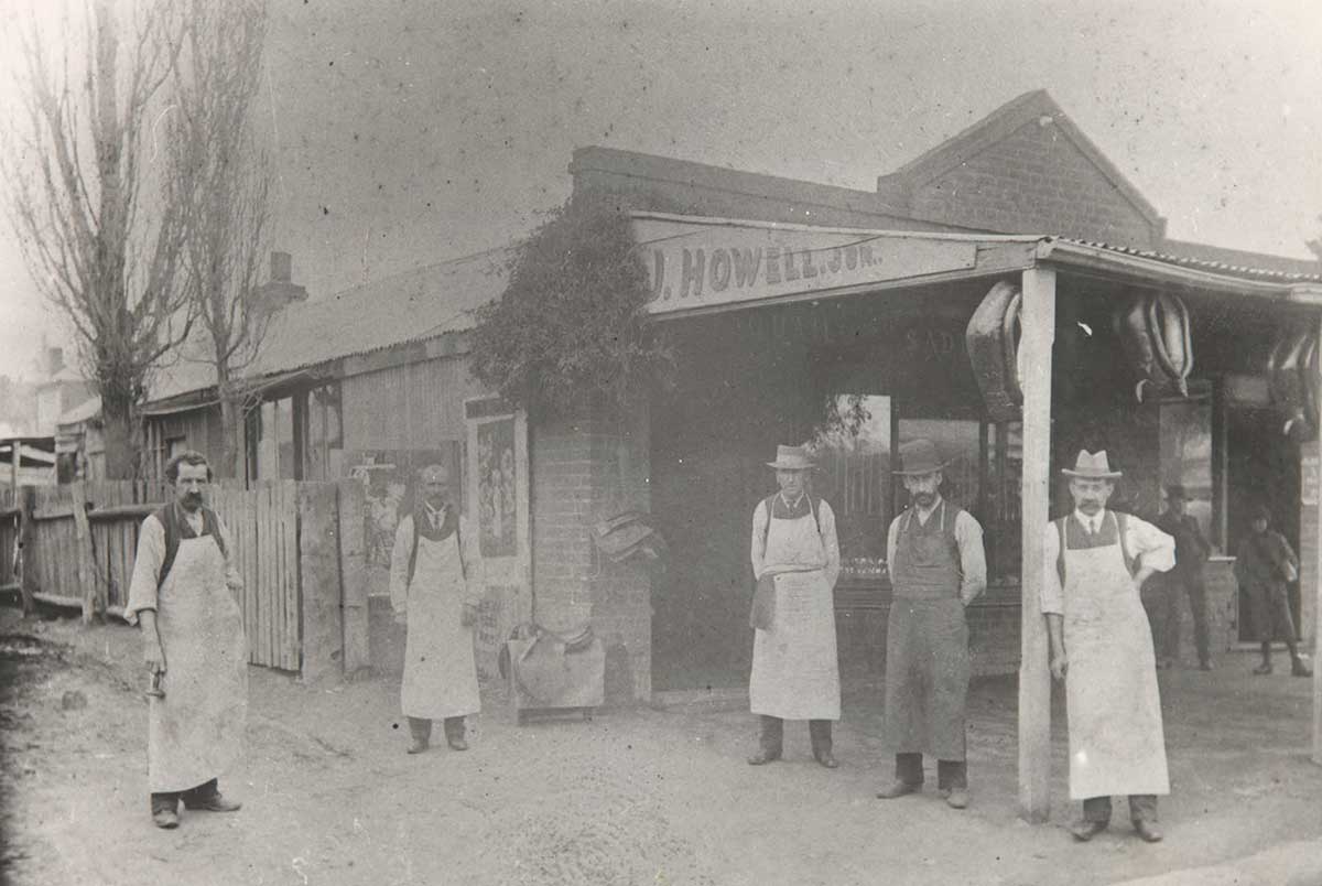 Employees standing out Quail's Saddlery Shop.